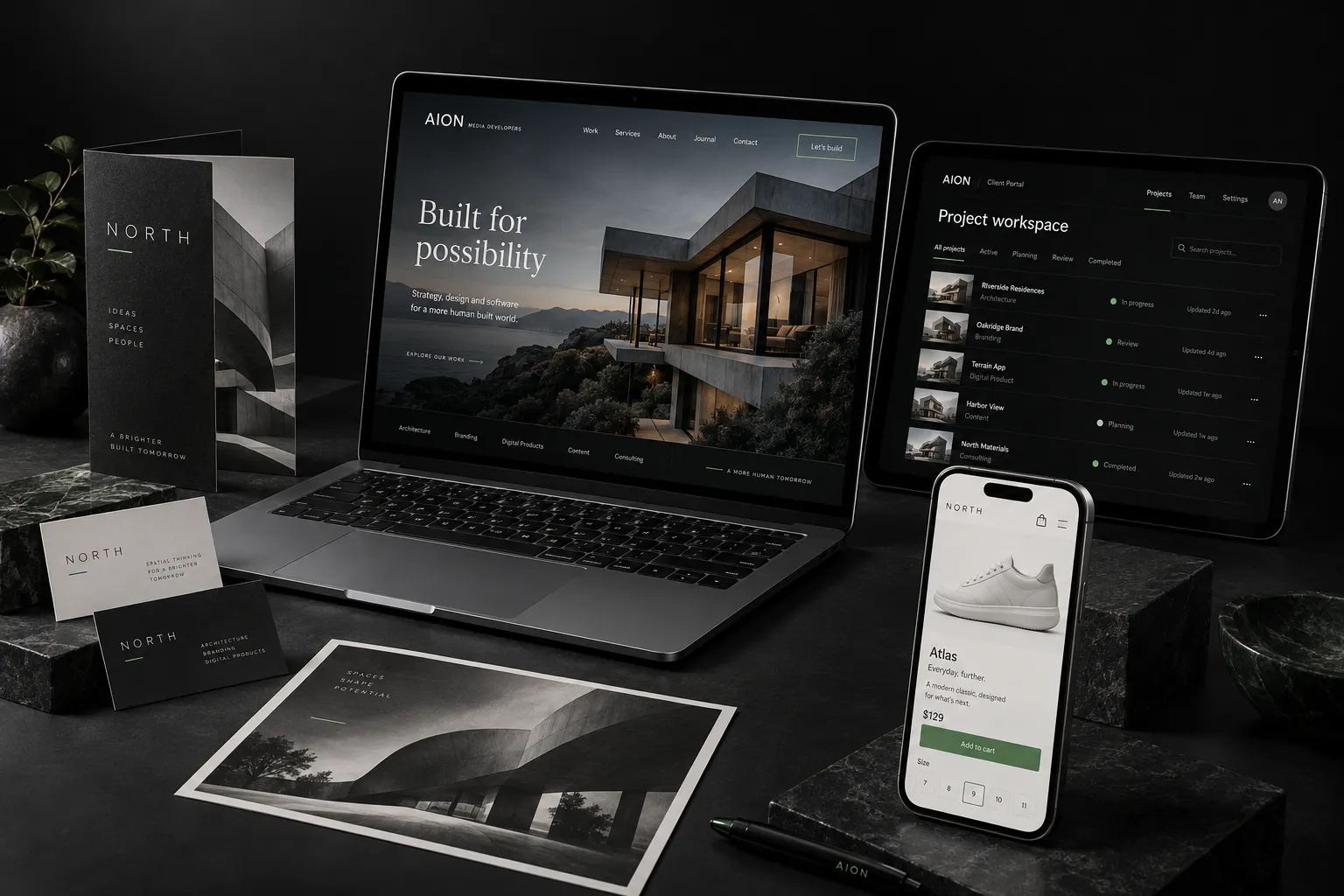 AION concept showcase: a laptop website, mobile online store, software portal and coordinated printed brand materials